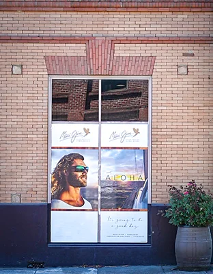 A window advertisement for Maui Jim eyewear