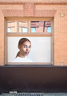A window advertisement for Modo eyewear