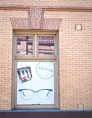A window advertisement for NW77 eyewear