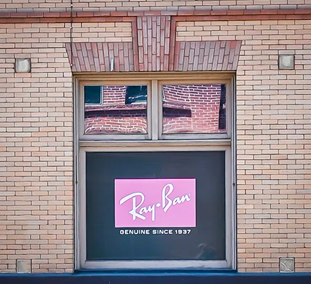 A window advertisement for Ray Ban eyewear